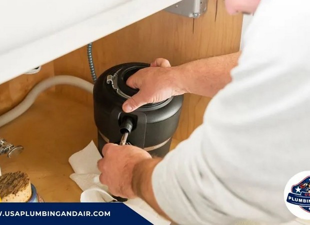 Certified plumber replacing a damaged garbage disposal unit in Las Vega