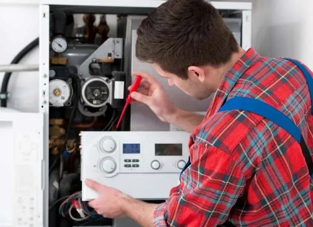 Modern energy-efficient tankless water heater installed by USA Plumbing & Air