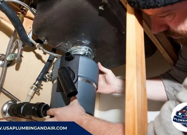 Plumber fixing a clogged garbage disposal drain in a Las Vegas property