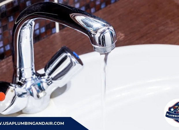 Plumber troubleshooting a slow-draining sink in a Las Vegas property