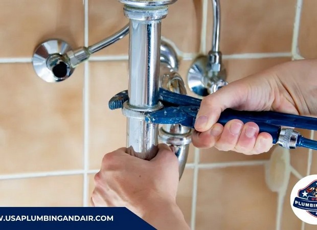 Repairing a clogged shower drain during plumbing service in Las Vegas
